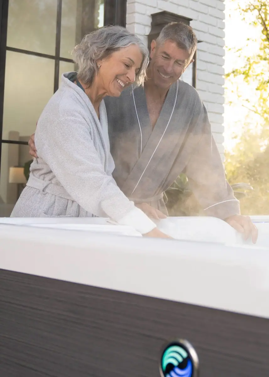 hot spring highlife luxury hot tub aria alpine white charcoal older couple touching water Patio Pools & Spas Tucson hot spring highlife luxury hot tub aria alpine white charcoal older couple touching water Patio Pools & Spas Tucson